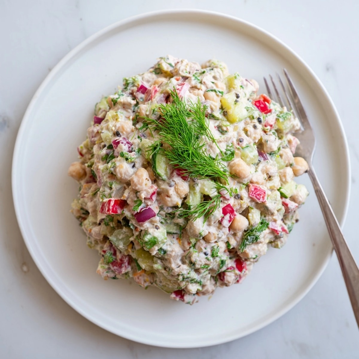 Close-up of chickpea tuna salad, a plant-based recipe with crispy vegetables folded in.