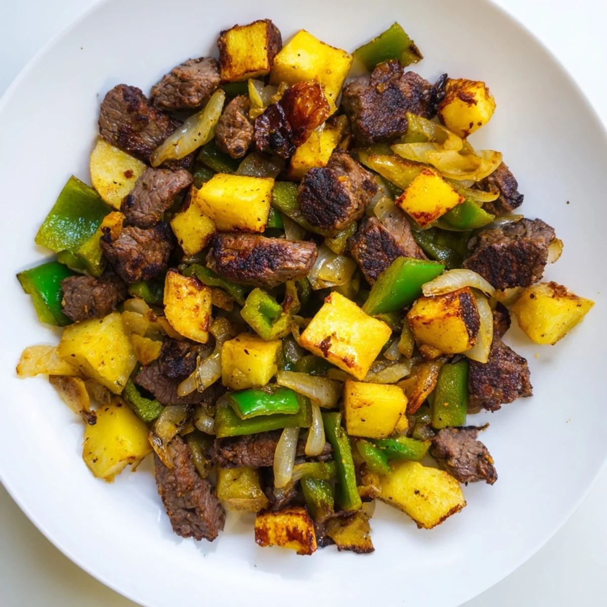 Hearty American-style Beef Hash, an easy meal bursting with flavors of onion and bell pepper.