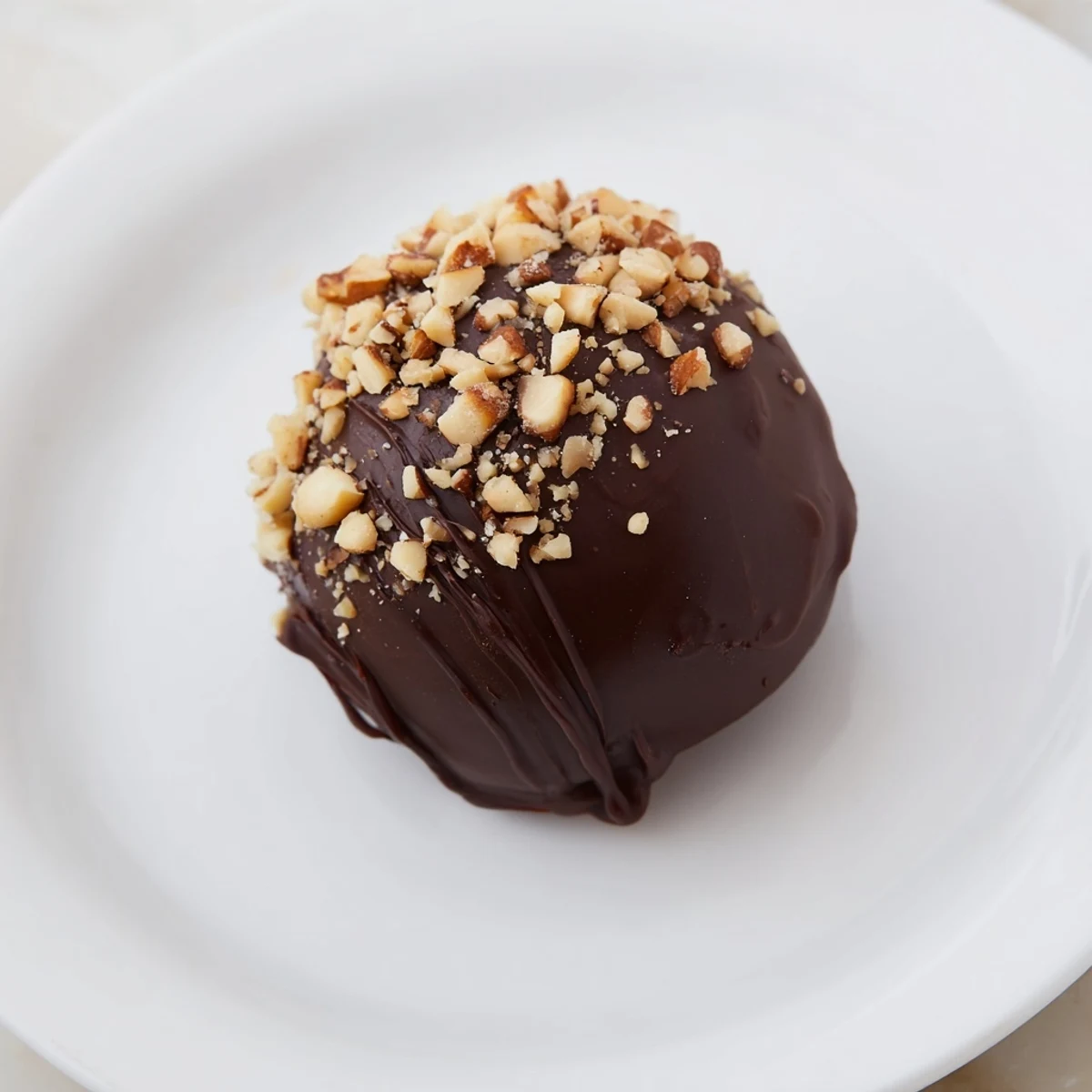 Velvety chocolate truffles coated in shredded coconut, a perfect bite for any sweet tooth craving.