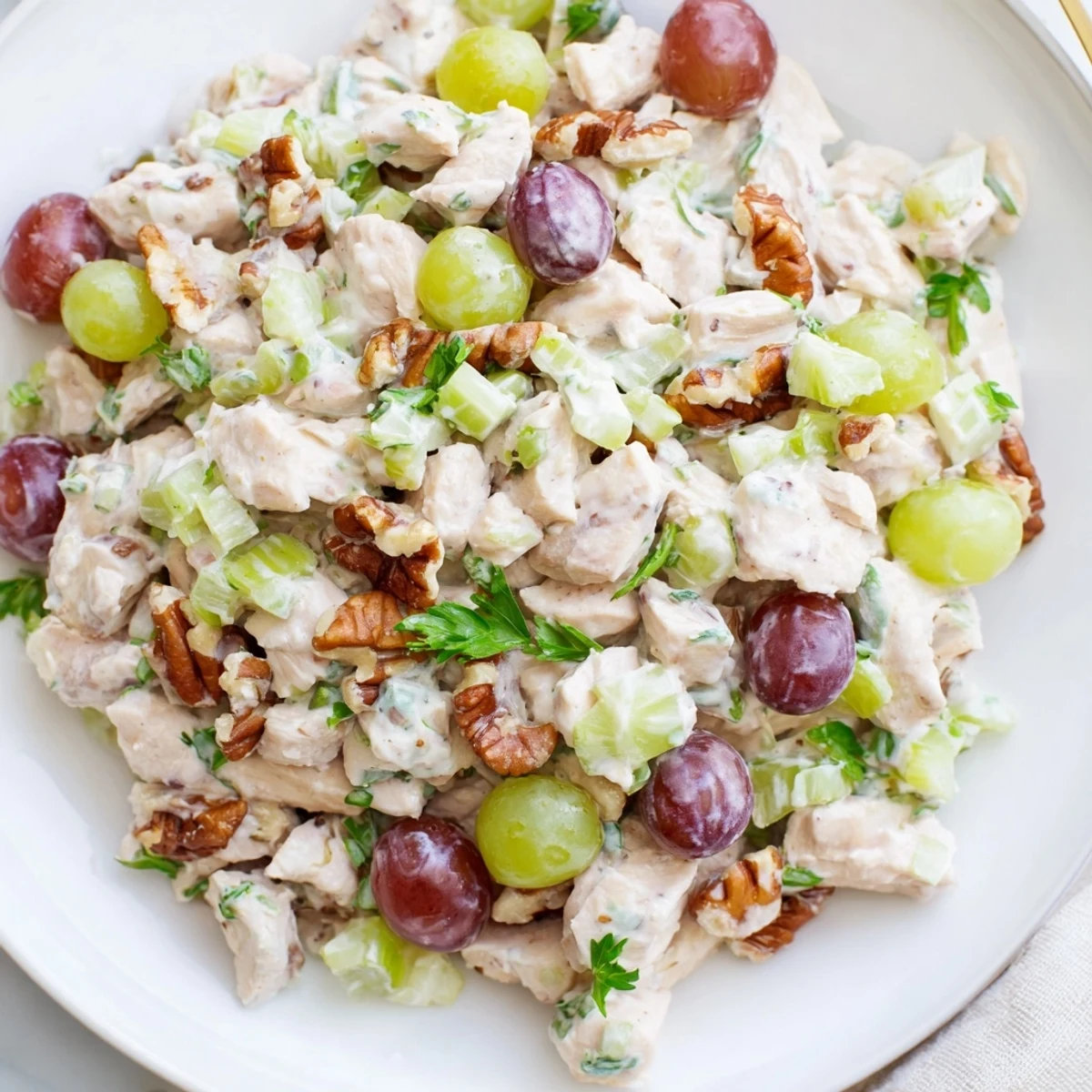 Creamy, chilled chicken salad with pecans, ready to be scooped onto a toasted sandwich.