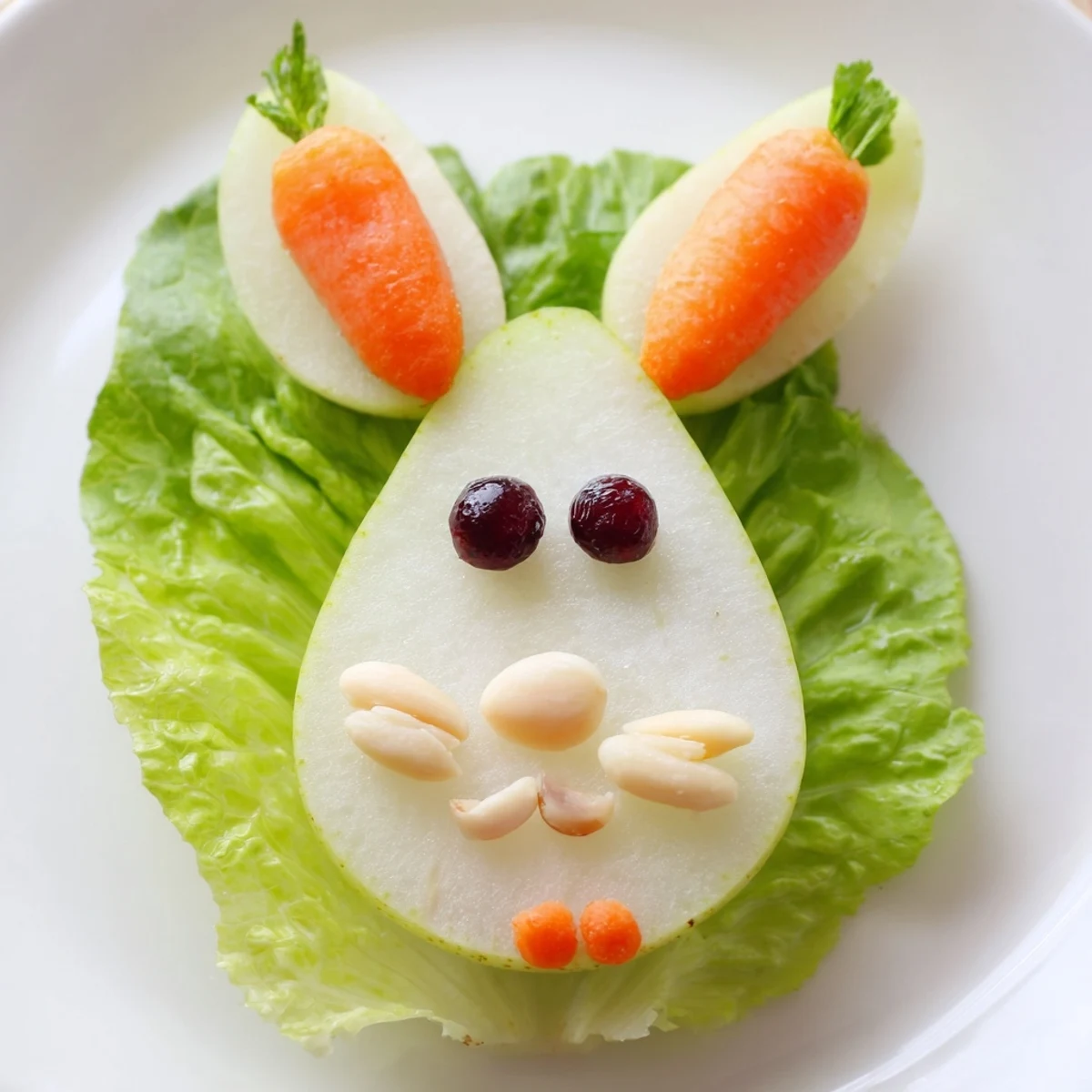 Adorable pear halves decorated as bunnies with almond ears and cottage cheese tails for Easter