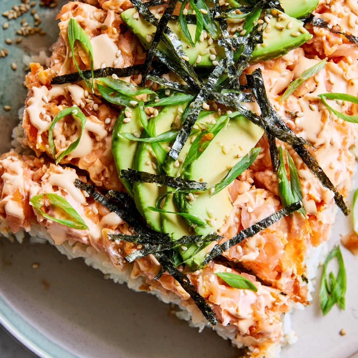 Japanese-style salmon sushi bake with tender flaky fish and toasted sesame seed topping