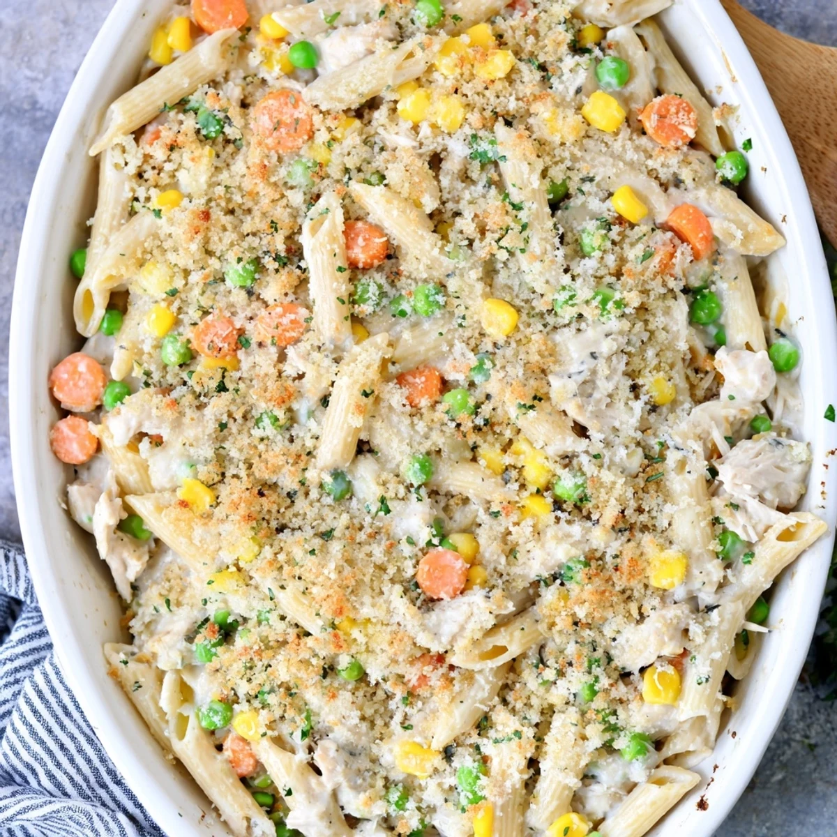 Hearty chicken pot pie pasta bake with golden buttery crumb topping served piping hot for a comforting family dinner