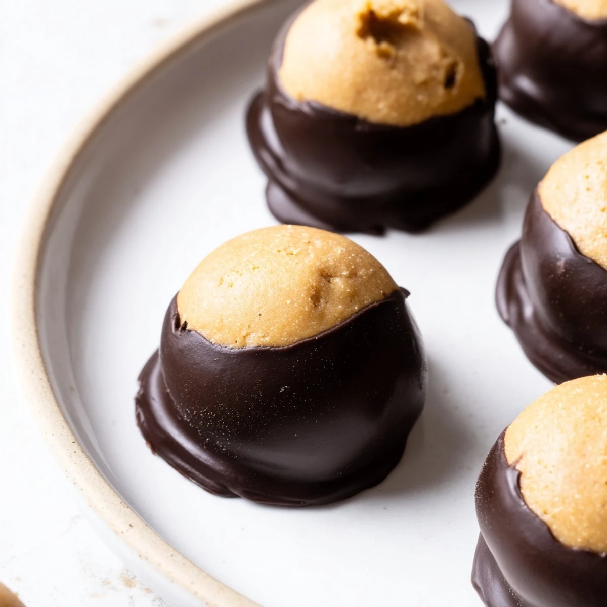 Classic buckeye cookies with creamy peanut butter centers dipped in glossy dark chocolate