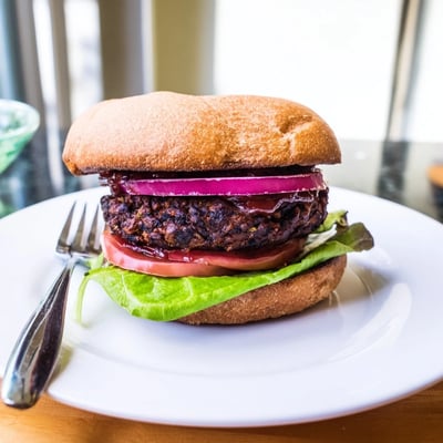 Coffee rub burgers topped with rich smoky BBQ sauce on toasted buns